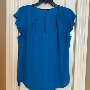 Beautiful blue blouse with ruffles.